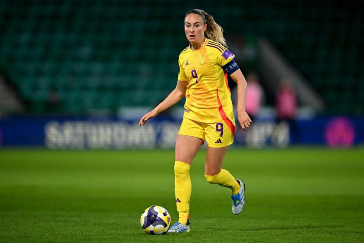 Belgium's forward #09 Tessa Wullaert runs with the ball during the Women's FIFA world cup league B, group 4, qualifier football match between Scotland and Belgium at Easter Road, in Edinburgh, Scotland, on April 14, 2026. ANDY BUCHANAN / AFP