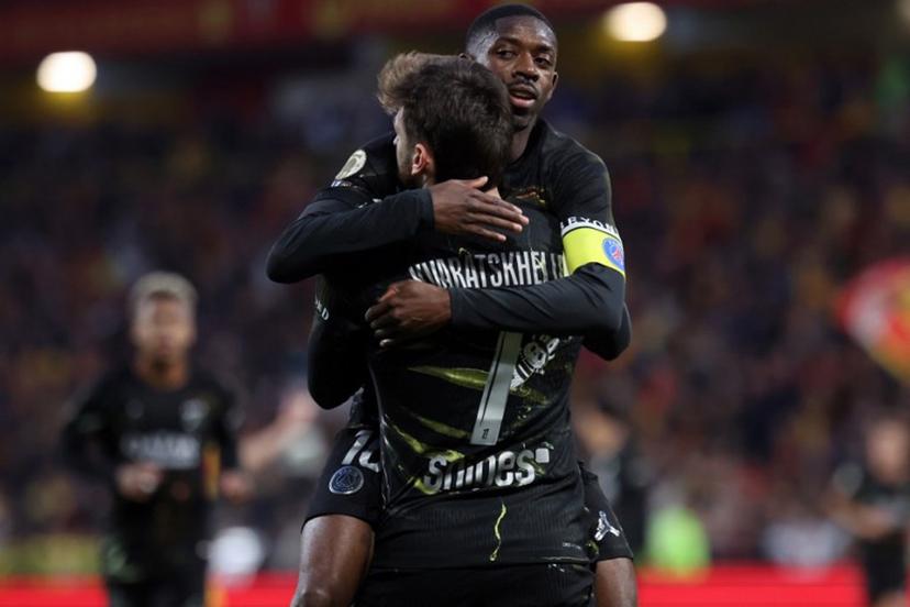 Paris Saint-Germain's Georgian forward #07 Khvicha Kvaratskhelia (front) is congratulated by Paris Saint-Germain's French forward #10 Ousmane Dembele after scoring a goal during the French L1 football match between RC Lens and Paris Saint-Germain (PSG) at the Stade Bollaert-Delelis stadium in Lens on May 13, 2026. Francois LO PRESTI / AFP