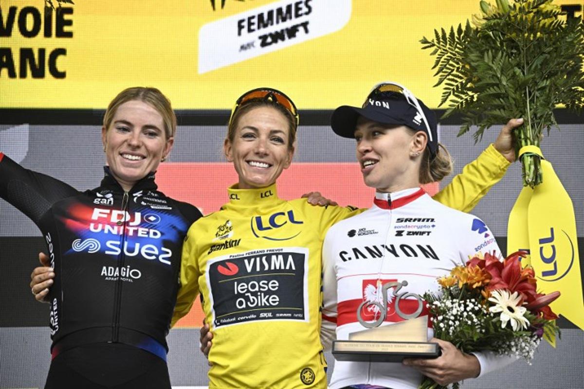 (From L) Second-placed FDJ-SUEZ team's Dutch rider Demi Vollering, overall winner Team Visma | Lease a Bike's French rider Pauline Ferrand-Prevot and third-placed Canyon//SRAM Racing team's Polish rider Katarzyna Niewiadoma celebrate on the podium after the 9th and last stage of the fourth edition of the Women's Tour de France cycling race at the end of the 9th and final stage (out of 9) 124.1 km from Praz-sur-Arly to Chatel, in Chatel, eastern France on August 3, 2025. JULIEN DE ROSA / AFP