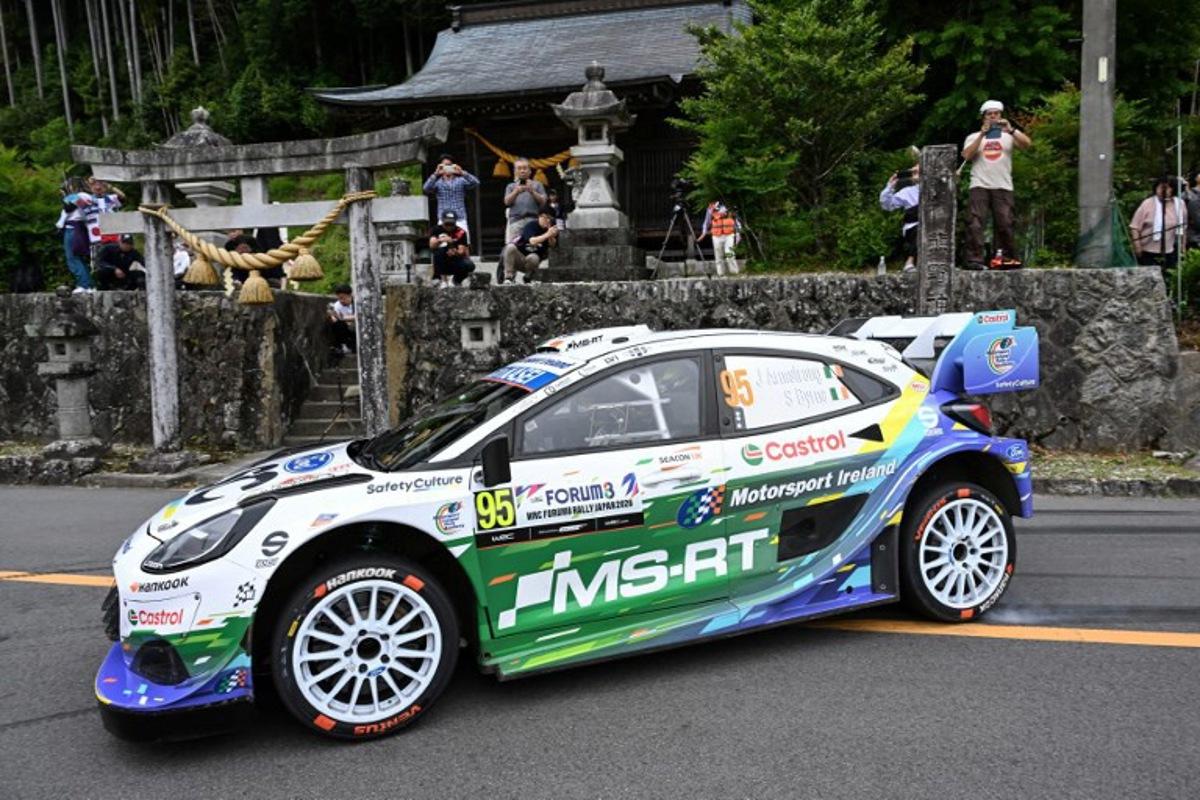 Jon Armstrong of Ireland and his co-driver Shane Byrne of Ireland drive their Ford Puma Rally1 during the SS16 Lake Mikawako section of the Rally Japan, the 7th round of FIA World Rally Championships, in Toyota city, Aichi prefecture on May 31, 2026. Toshifumi KITAMURA / AFP