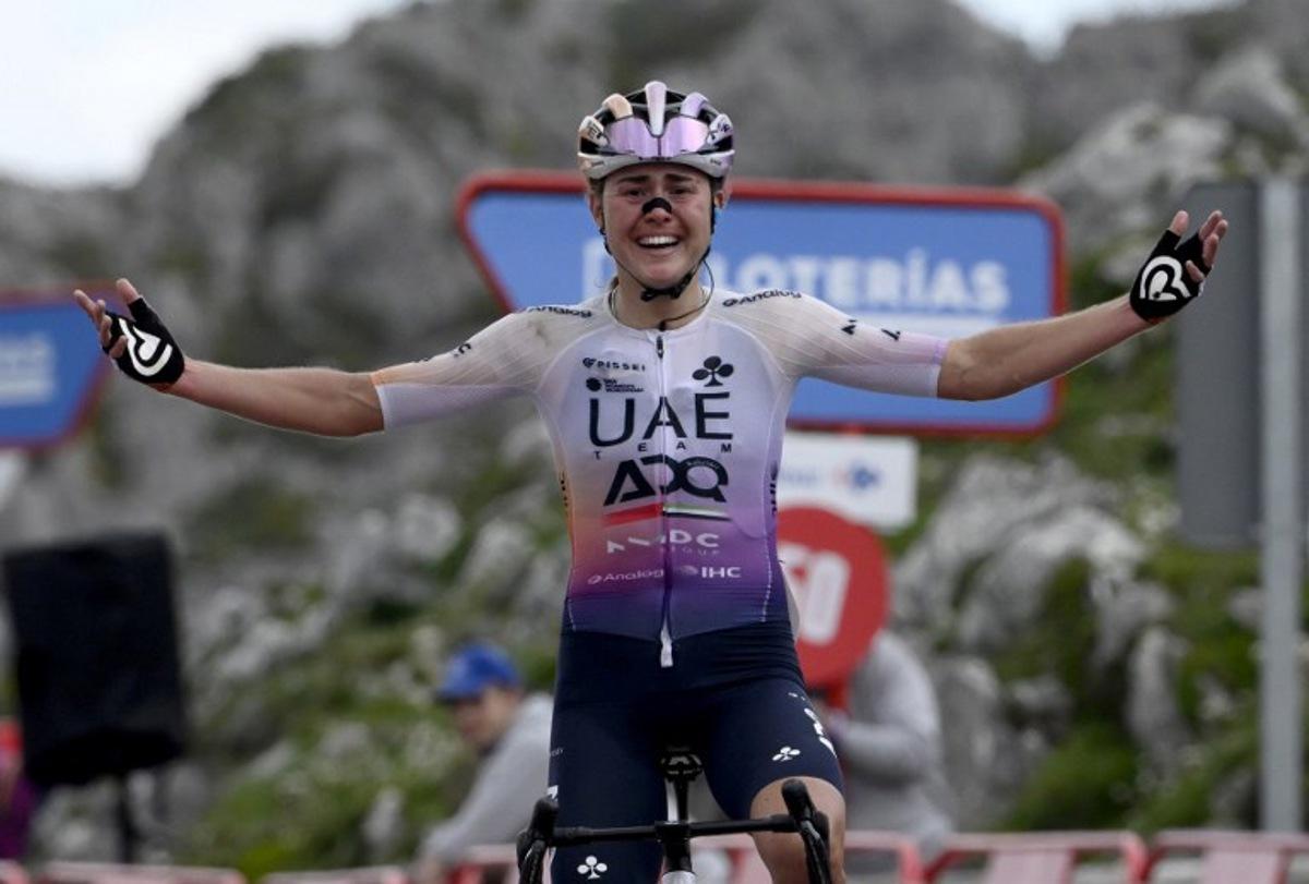 Overall leader team UAE ADQ's Spanish rider Paula Blasi Cairol celebrates winning the 2026 La Vuelta Femenina cycling tour of Spain, at Alto de l'Angliru, on May 9, 2026. Miguel RIOPA / AFP