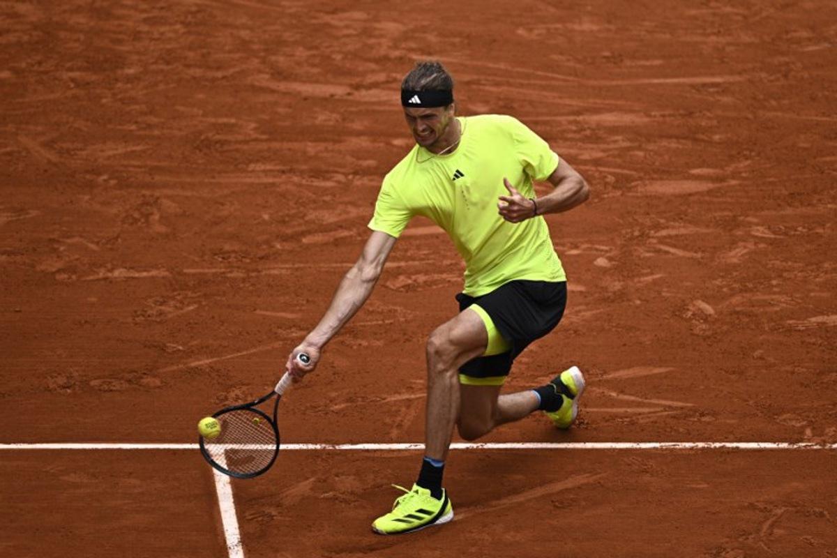 Germany's Alexander Zverev plays a forehand return to US Learner Tien during their men's singles match on day 3 of the French Open tennis tournament on Court Suzanne-Lenglen at the Roland-Garros Complex in Paris on May 27, 2025. JULIEN DE ROSA / AFP