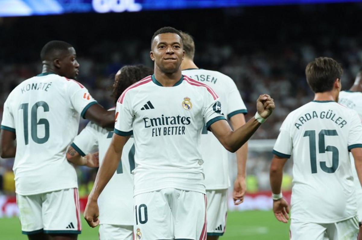 Real Madrid's French forward #10 Kylian Mbappe celebrates scoring his team's second goal during the Spanish league football match between Real Madrid CF and Real Sociedad at Santiago Bernabeu Stadium in Madrid on August 26, 2026. Thomas COEX / AFP