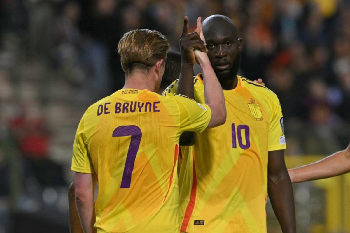 Belgium's forward #10 Romelu Lukaku celebrates with Belgium's midfielder #07 Kevin De Bruyne (L) after scoring Belgium's fourth goal during the FIFA World Cup 2026 Group J European qualification football match between Belgium and Wales at the King Baudouin Stadium in Brussels, on June 9, 2025. NICOLAS TUCAT / AFP