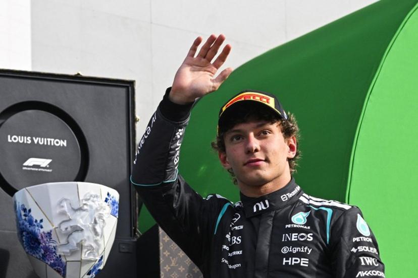 P2 Mercedes' Italian driver Kimi Antonelli celebrates on the podium after the Formula One Dutch Grand Prix at The Circuit Zandvoort, western Netherlands, on August 23, 2026. JOHN THYS / AFP