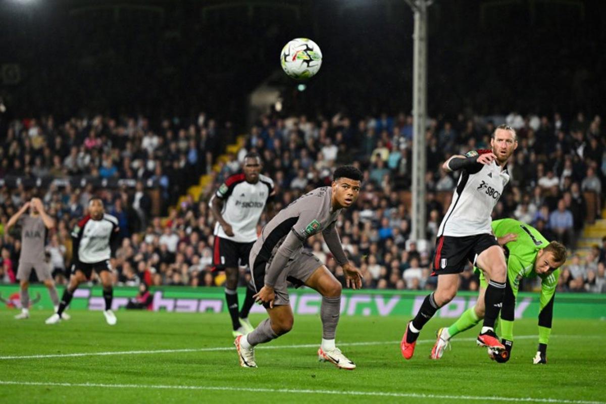 Fulham's Canadian defender #44 Luc de Fougerolles eyes the ball during the English League Cup football match between Fulham and Tottenham Hotspur at Craven Cottage stadium, in London, on August 29, 2023. Glyn KIRK / AFP