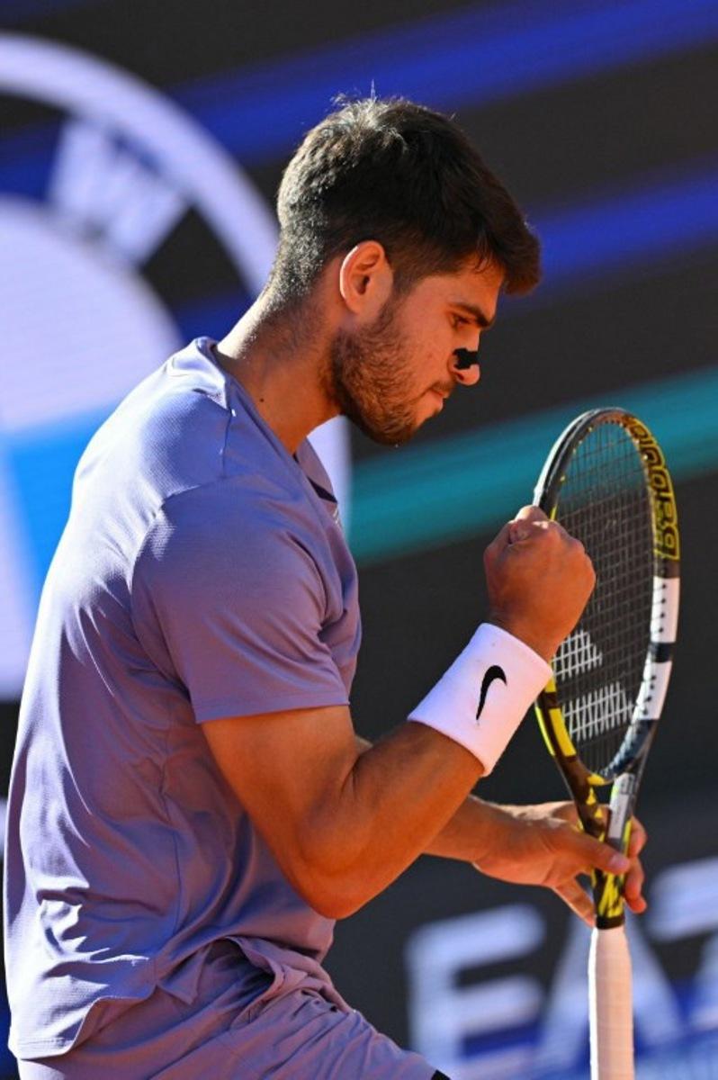 Spain's Carlos Alcaraz reacts during his men's singles semi-final match against Italy's Lorenzo Musetti for the ATP Rome Open tennis tournament at Foro Italico in Rome on May 16, 2025. Andreas SOLARO / AFP