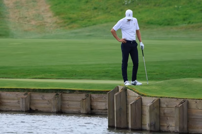 Belgium's Adrien Dumont de Chassart looks on after his ball fell in the water in round 3 of the men's golf individual stroke play of the Paris 2024 Olympic Games at Le Golf National in Guyancourt, south-west of Paris on August 3, 2024. Emmanuel DUNAND / AFP