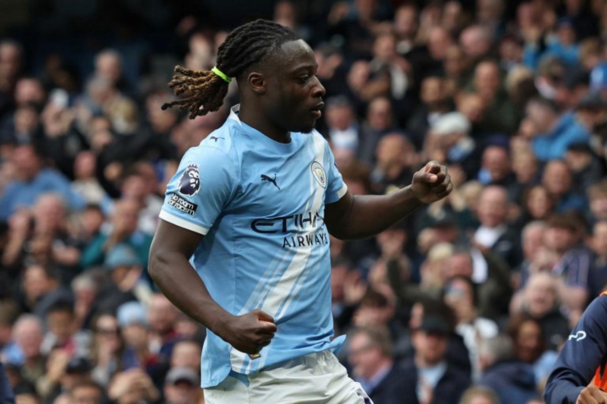 Manchester City's Belgian midfielder #11 Jeremy Doku celebrates after scoring the opening goal during the English Premier League football match between Manchester City and Brentford at the Etihad Stadium in Manchester, north west England, on May 9, 2026. Darren Staples / AFP