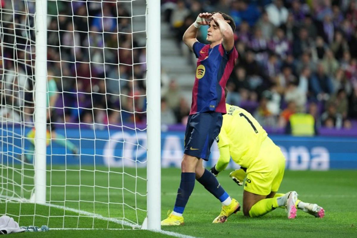 Barcelona's Spanish forward #18 Pau Victor Delgado reacts to missing a goal opportunity during the Spanish league football match between Real Valladolid FC and FC Barcelona at the Jose Zorrilla stadium in Valladolid on May 3, 2025. Cesar Manso / AFP