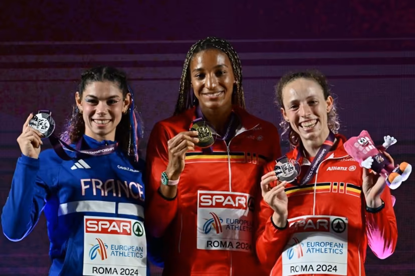 Gold medallist Belgium's athlete Nafissatou Thiam (C) celebrates with silver medallist France's Auriana Lazraq-Khlass (L) and bronze medallist Belgium's Noor Vidts during the medal ceremony for the women's heptathlon during the European Athletics Championships at the Olympic stadium in Rome on June 8, 2024. Filippo MONTEFORTE / AFP