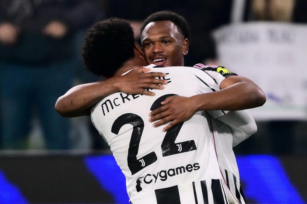 Juventus' Belgian forward #20 Lois Openda (R) celebrates after scoring Juventus's second goal with Juventus' US midfielder #22 Weston McKennie (L) during the Italian Serie A football match between Juventus and AS Roma at the Allianz stadium in Turin, northern Italy, on December 20, 2025. MARCO BERTORELLO / AFP