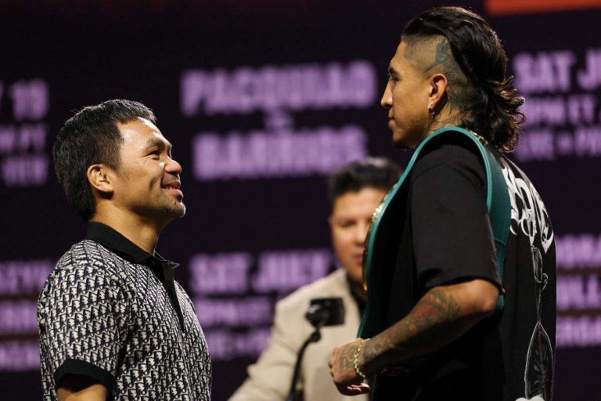 Filipino boxer Manny Pacquiao (L) and Mexican-US boxer Mario Barrios face off during the press conference ahead of their July 19 WBC welterweight title fight at the NOVO at L.A. Live in Los Angeles on June 3, 2025. Manny Pacquiao on June 3 shrugged off concerns about his decision to return to boxing at the age of 46 as he prepares for next month's world welterweight title comeback against Mario Barrios. The charismatic Filipino boxing icon stunned the sports world last month after announcing he would take on World Boxing Council (WBC) champion Barrios on July 19 in Las Vegas, four years after his last fight ended in a disappointing defeat. Patrick T. Fallon / AFP