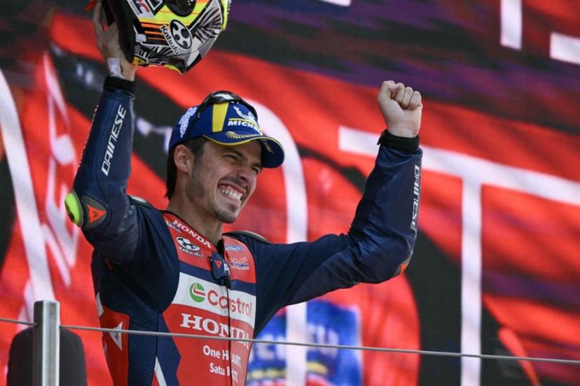 Team Repsol Honda Team's Joan Mir celebrates on the podium after finishing in second place at the 2026 Catalunya Moto GP Grand Prix at the Catalunya racetrack in Montmelo, near Barcelona, on May 17, 2026. JOSE JORDAN / AFP