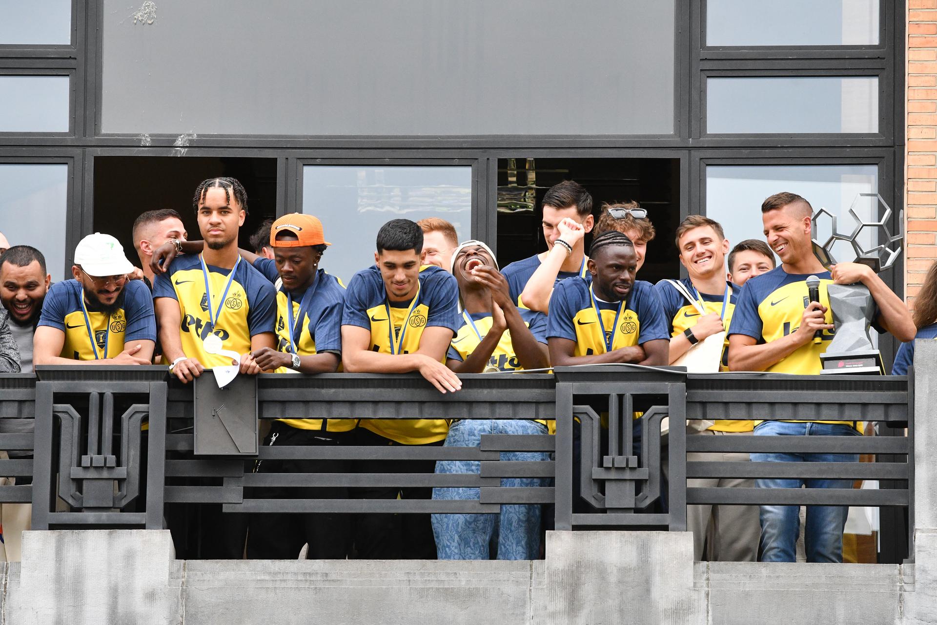 Union's players pictured during the official ceremony organized at the Forest town hall, on the occasion of the Belgian champion title won by Union Saint-Gilloise, on Monday 26 May 2025. Yesterday, Union Saint-Gilloise won the 2024-2025 'Jupiler Pro League' first division of the Belgian championship. BELGA PHOTO JILL DELSAUX
