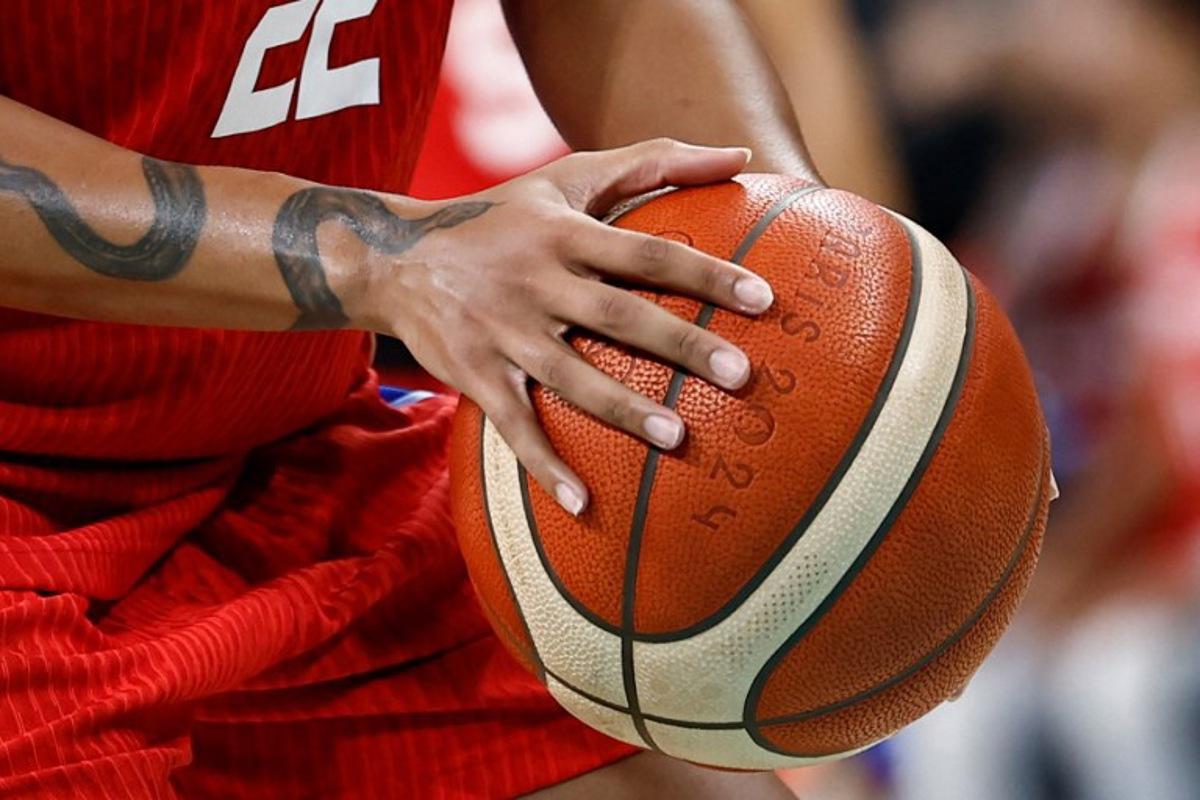 Puerto Rico's #22 Arella Guirantes holds the ball in the women's preliminary round group A basketball match between China and Puerto Rico during the Paris 2024 Olympic Games at the Pierre-Mauroy stadium in Villeneuve-d'Ascq, northern France, on August 3, 2024. Sameer Al-Doumy / AFP