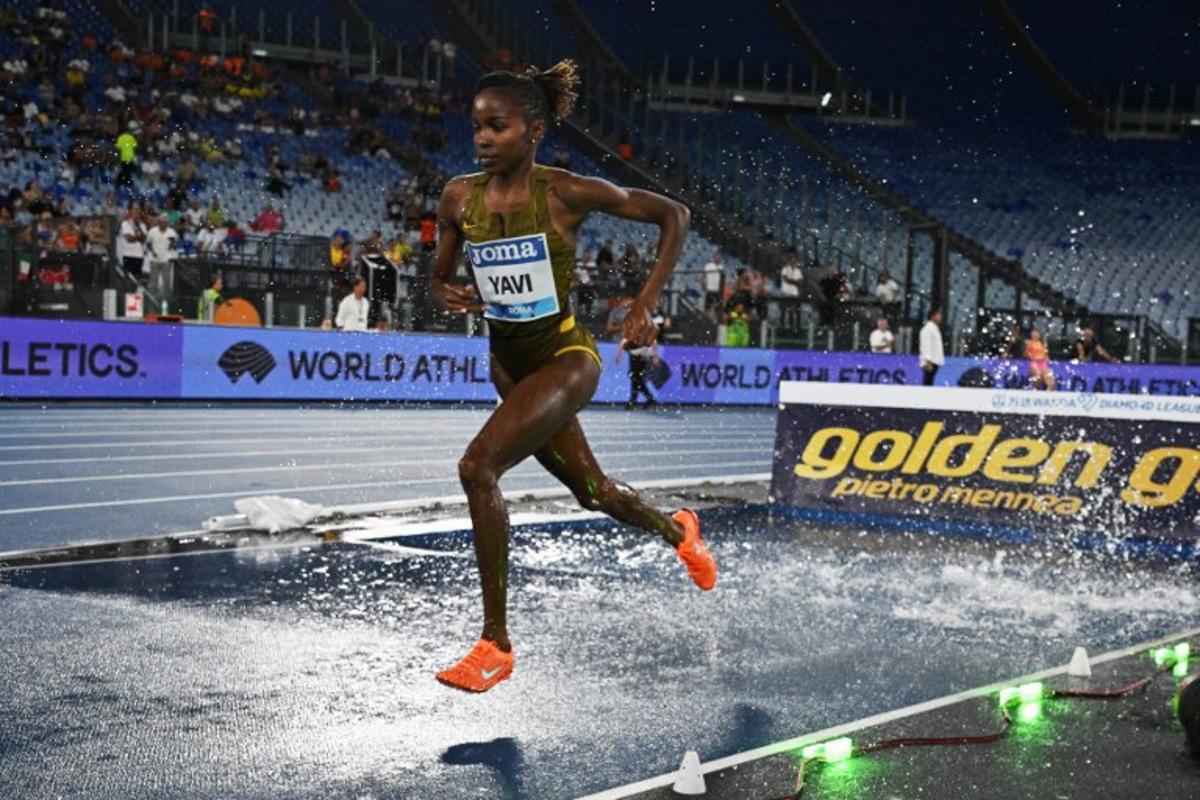 Bahrain's Winfred Mutile Yavi competes in the women's 3000m steeplechase event of the Diamond League athletics meeting at the Olympic stadium in Rome on August 30, 2024. Tiziana FABI / AFP