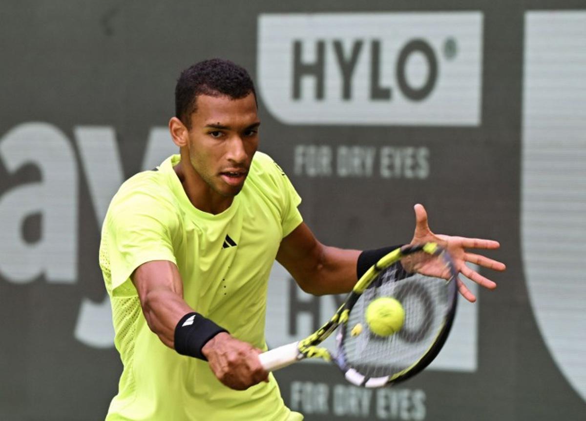 Canada's Felix Auger-Aliassime returns a ball to Russia's Karen Khachanov (not in picture) during their match at the ATP tennis tournament in Halle (Westfalen), western Germany, on June 19, 2025. CARMEN JASPERSEN / AFP
