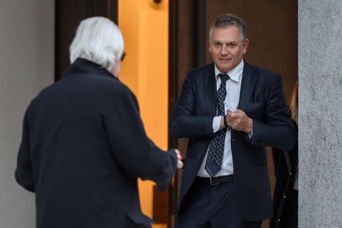 Former FIFA number two Jerome Valcke (R) leaves on the opening day of an appeal before the Swiss Federal Criminal Court in Bellinzona, southern Switzerland, on March 7, 2022. The Federal Prosecutor's Office appealed an October 2020 judgement which acquitted Al-Khelaifi and handed former FIFA number two Jerome Valcke a suspended sentence on accusation of "corrupt agreement » on some 2026 and 2030 FIFA World Cups media rights. Fabrice COFFRINI / AFP