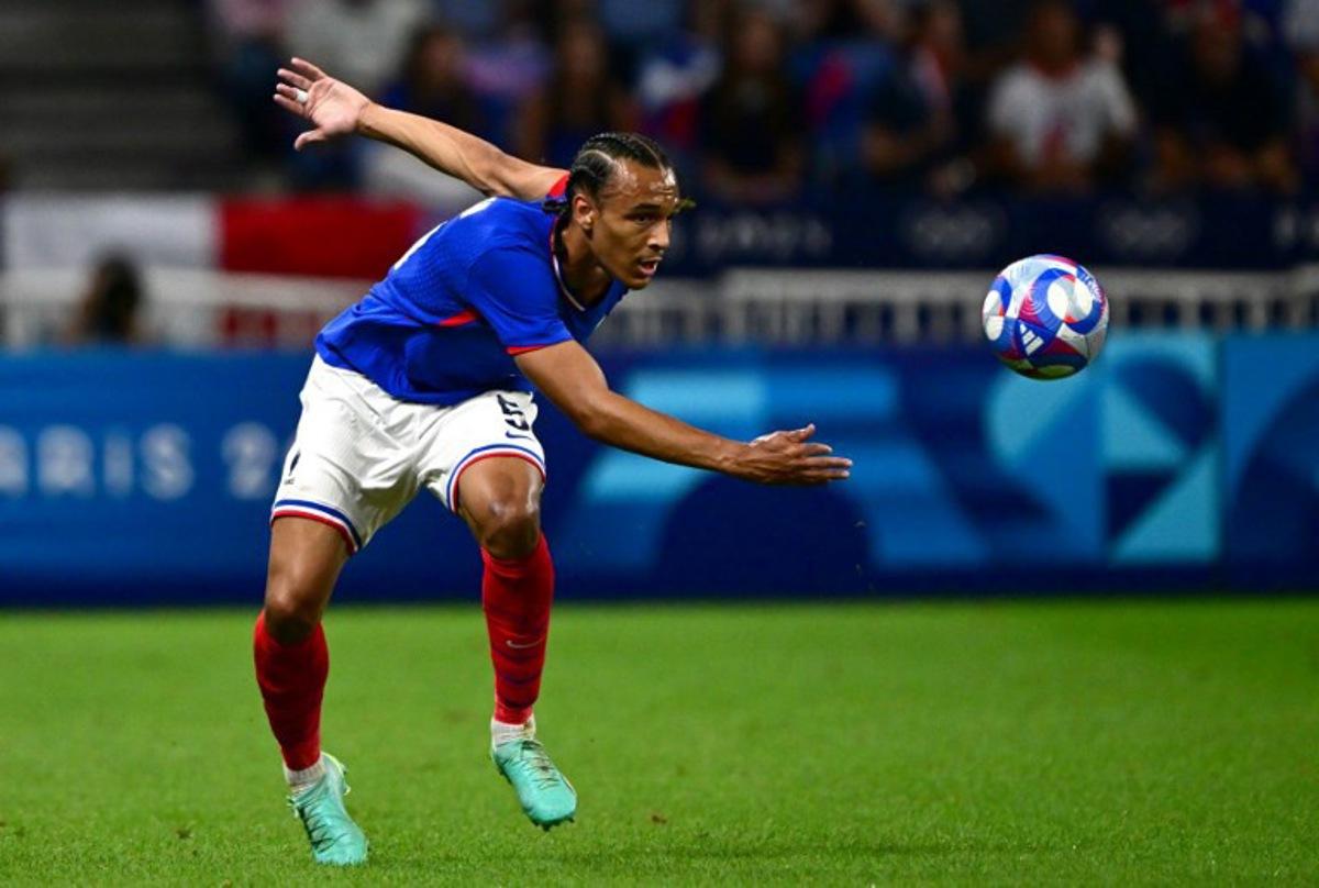 France's defender #05 Kiliann Sildillia eyes the ball during the men's semi-final football match between France and Egypt during the Paris 2024 Olympic Games at the Lyon Stadium in Lyon on August 5, 2024. Olivier CHASSIGNOLE / AFP