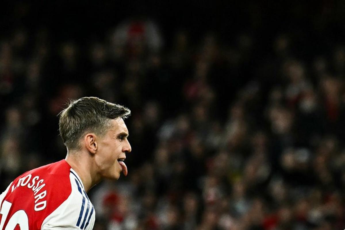 Arsenal's Belgian midfielder #19 Leandro Trossard celebrates after scoring his team second goal during the English Premier League football match between Arsenal and Crystal Palace at the Emirates Stadium in London on April 23, 2025. Ben STANSALL / AFP