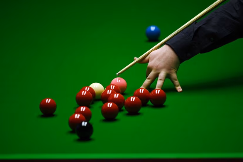 Jackson Page of Wales plays a shot during the World Snooker Championship Round Two match against Mark Williams of Wales at the Crucible Theatre, in Sheffield, northern England, on April 22, 2022. OLI SCARFF / AFP