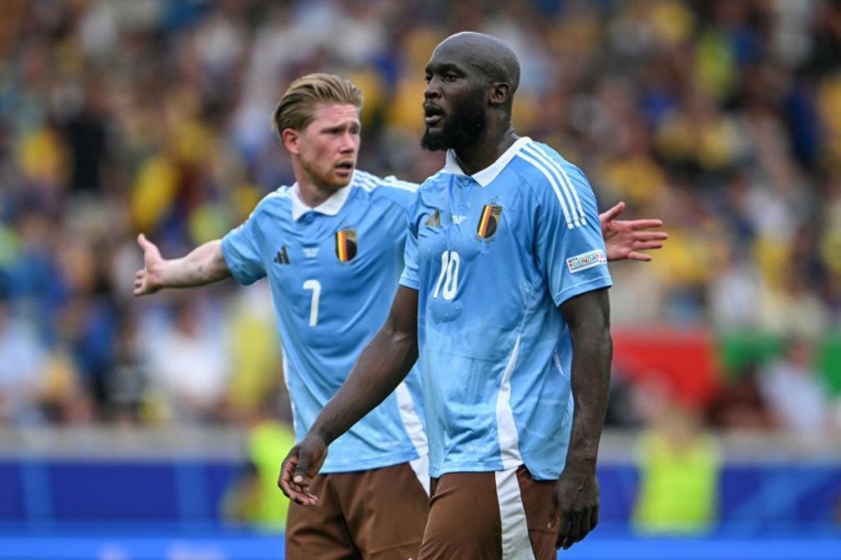 Belgium's forward #10 Romelu Lukaku and midfielder #07 Kevin de Bruyne react during the UEFA Euro 2024 Group E football match between Ukraine and Belgium at the Stuttgart Arena in Stuttgart on June 26, 2024. Fabrice COFFRINI / AFP