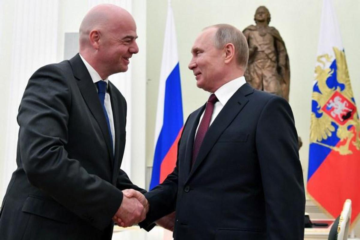 Russian President Vladimir Putin shakes hands with FIFA President Gianni Infantino during a meeting at the Kremlin in Moscow on February 20, 2019. Yuri KADOBNOV / POOL / AFP