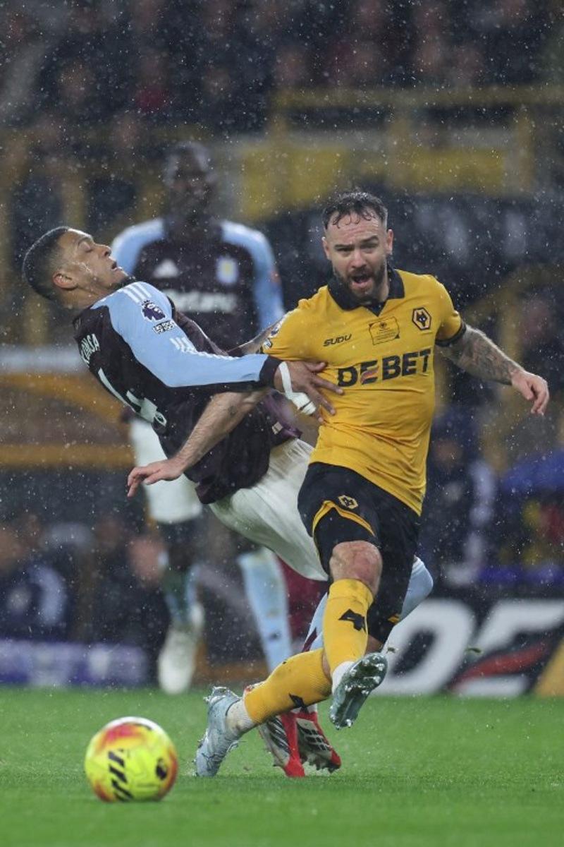 Aston Villa's English defender #04 Ezri Konsa (L) vies with Wolverhampton Wanderers' English forward #09 Adam Armstrong (R) during the English Premier League football match between Wolverhampton Wanderers and Aston Villa at the Molineux stadium in Wolverhampton, central England on February 27, 2026. Darren Staples / AFP