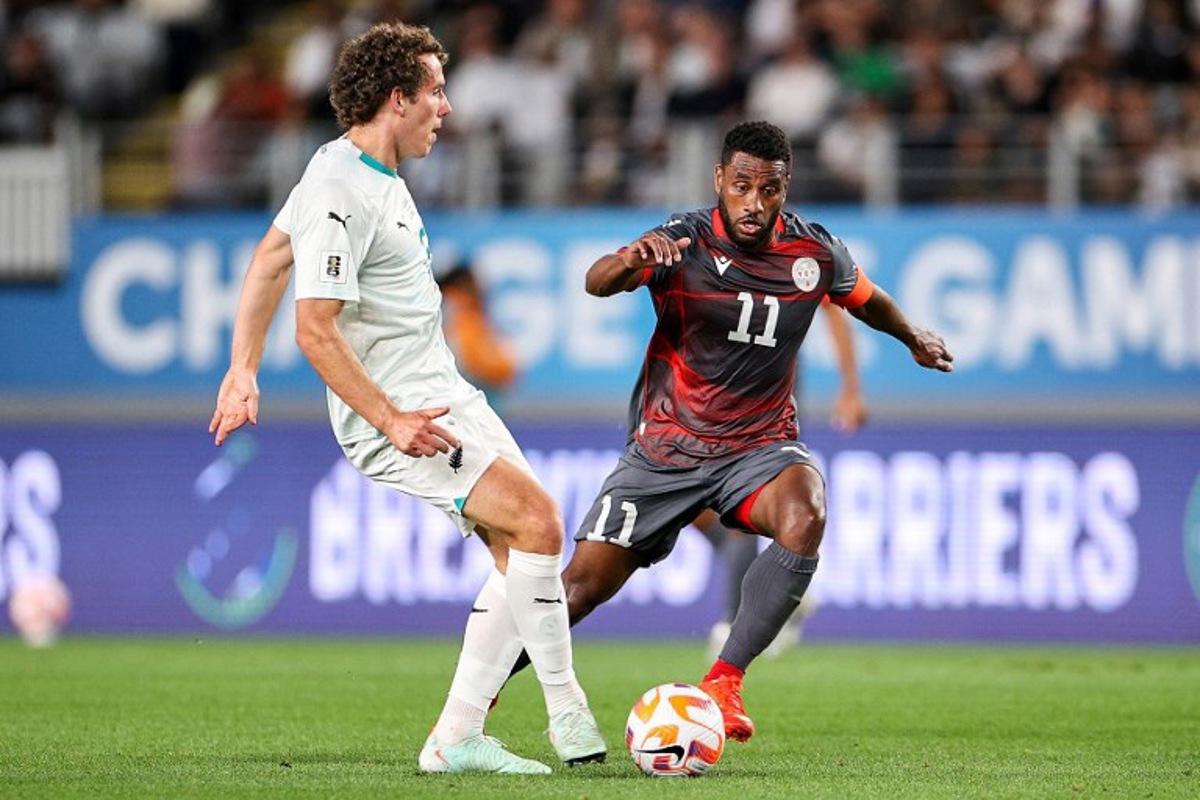 New Caledonia's Cesar Zeoula (R) challenges New Zealand's Joe Bell during the FIFA World Cup 2026 Oceania qualifiers group final football match between New Zealand and New Caledonia at Eden Park Stadium in Auckland on March 24, 2025. DAVID ROWLAND / AFP