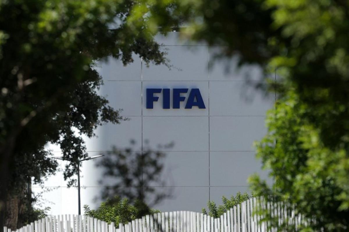 The FIFA logo is seen at its Africa regional office in Sale on August 5, 2026. President Gianni Infantino held emergency talks with other FIFA directors in Morocco on August 5, a source told AFP, amid a wave of criticism over his now shelved plan to open the World Cup to private investment. Abdelmajid BZIOUAT / AFP