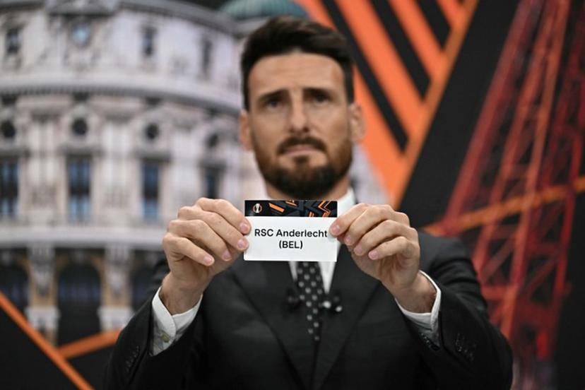 Former Spanish player Artiz Aduriz holds the paper slip of RSC Anderlecht during the 2024-2025 UEFA Europa League football tournament knockout play-off draw at the House of European Football in Nyon, on January 31, 2025. Fabrice COFFRINI / AFP