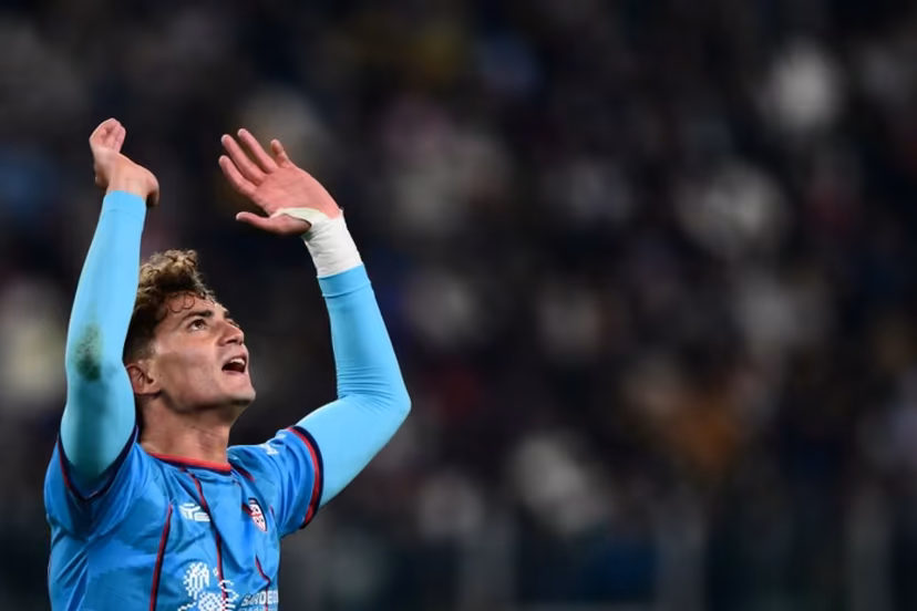 Cagliari's Italian forward #94 Sebastiano Esposito celebrates after scoring his team first goal during the Italian Serie A football match between Juventus and Cagliari at the Allianz Stadium, in Turin, northern Italy, on November 29, 2025. MARCO BERTORELLO / AFP