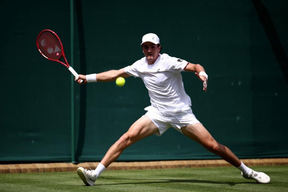 Brazil's Joao Fonseca returns to Spain's Roberto Bautista Agut during their men's singles first round tennis match on the first day of the 2026 Wimbledon Championships at The All England Lawn Tennis and Croquet Club in Wimbledon, southwest London, on June 29, 2026. Henry NICHOLLS / AFP