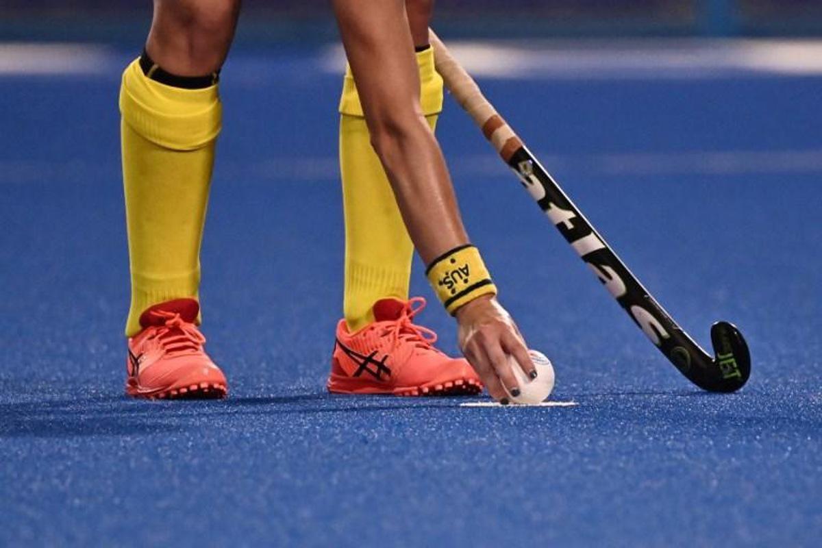 Australia's Kaitlin Nobbs places the ball on the penalty spot during the women's pool B match of the Tokyo 2020 Olympic Games field hockey competition against Japan, at the Oi Hockey Stadium in Tokyo on July 28, 2021. JEFF PACHOUD / AFP