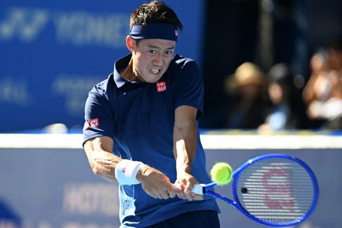 Japan's Kei Nishikori plays a shot to USA's Frances Tiafoe during their men's singles tennis match at the ATP Tour Japan Open Tennis Championships at the Ariake Tennis Forest Park in Tokyo on October 1, 2026. Rie KIKUCHI / AFP