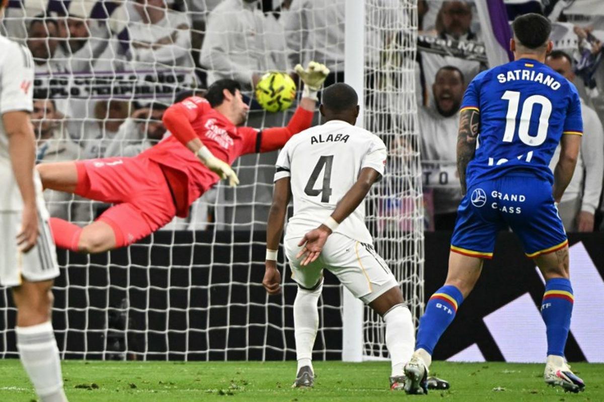Getafe's Uruguayan forward #10 Martín Satriano scores the opening goal during the Spanish league football match between Real Madrid CF and Getafe CF at Santiago Bernabeu Stadium in Madrid on March 2, 2026. Javier SORIANO / AFP
