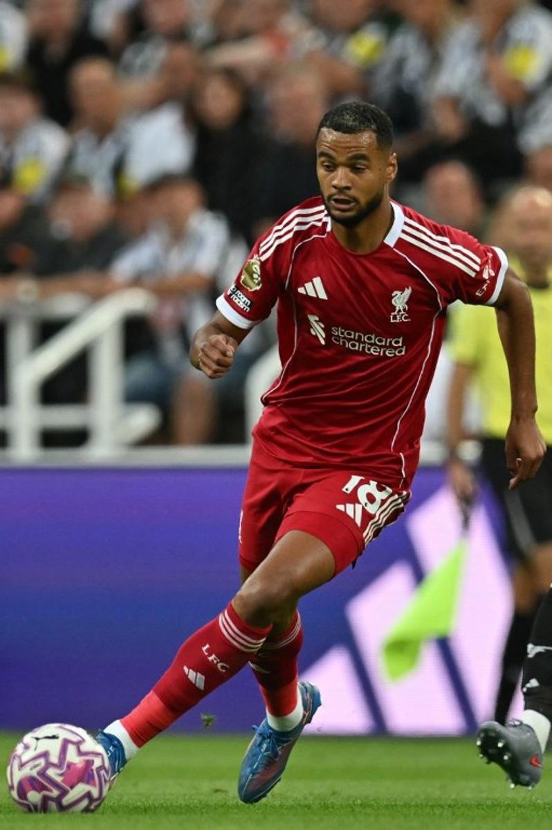 Liverpool's Dutch striker #18 Cody Gakpo runs with the ball during the English Premier League football match between Newcastle United and Liverpool at St James' Park in Newcastle-upon-Tyne, north east England on August 25, 2025. ANDY BUCHANAN / AFP