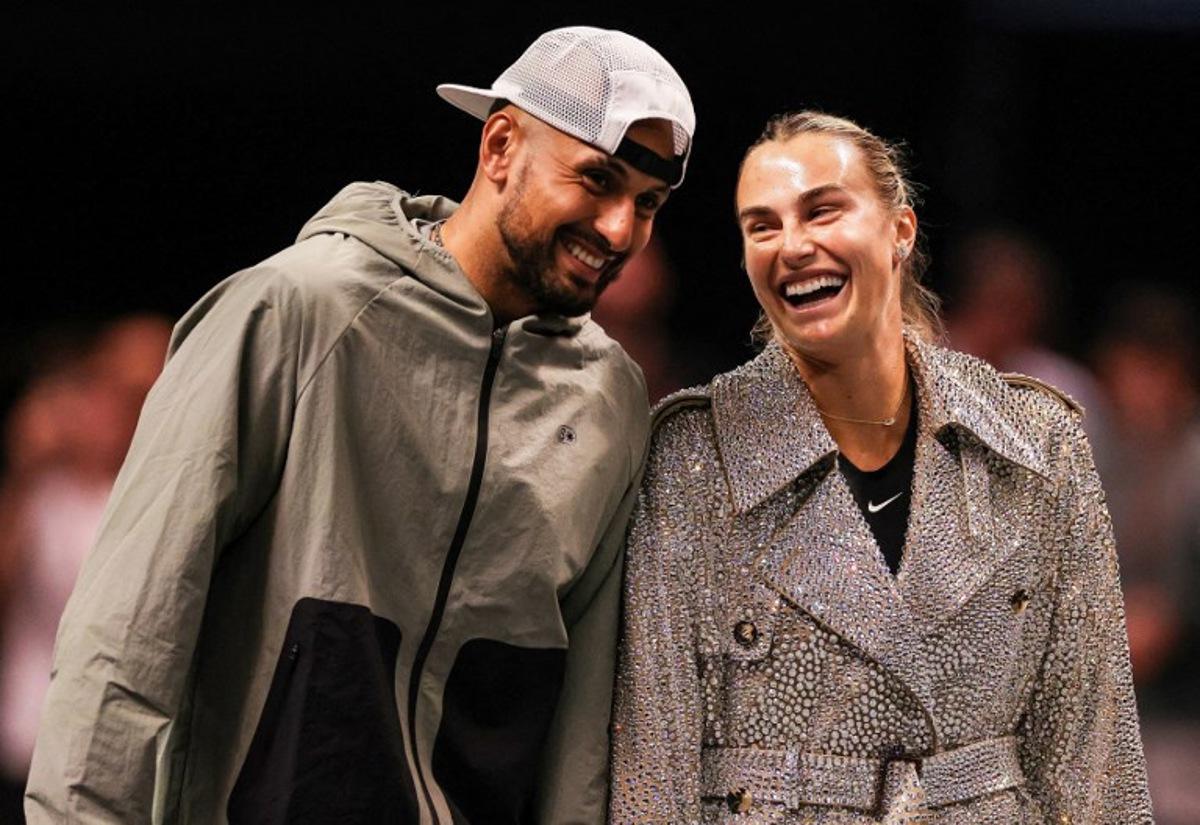 Australia's Nick Kyrgios (L) and Belarus' Aryna Sabalenka share a laugh prior to their Battle of the Sexes exhibition tennis match in Dubai on December 28, 2025. Amr Alfiky / POOL / AFP