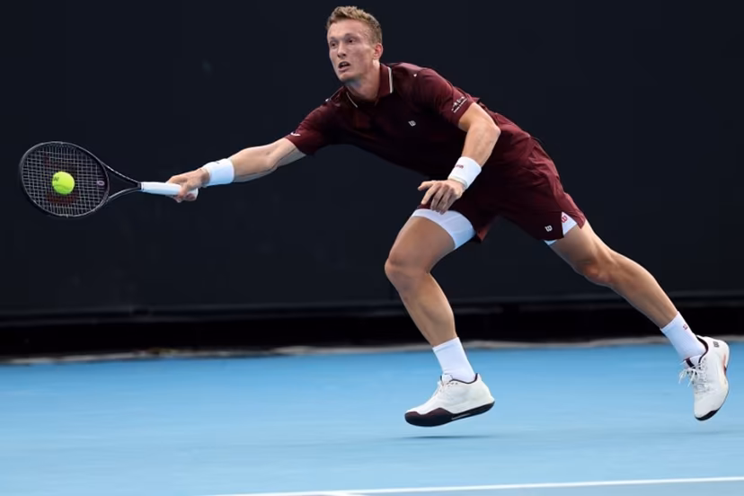Czech Republic's Jiri Lehecka hits a return to France's Arthur Gea during their men's singles match on day two of the Australian Open tennis tournament in Melbourne on January 19, 2026. Martin KEEP / AFP
