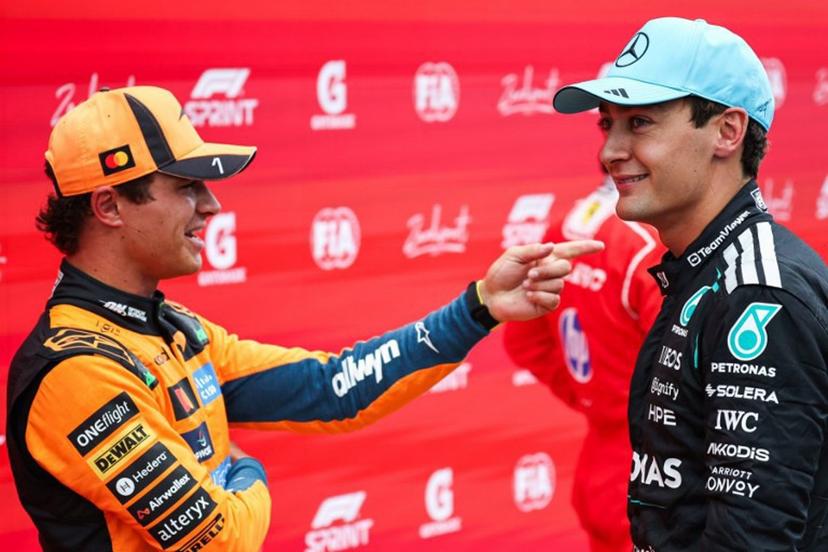 P2 McLaren's British driver Lando Norris (L) speaks with P1 Mercedes' British driver George Russell after the sprint race ahead of the Formula One Dutch Grand Prix at The Circuit Zandvoort, western Netherlands, on August 22, 2026. SIMON WOHLFAHRT / AFP