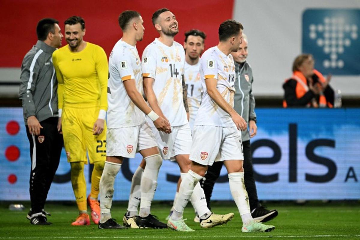 North Macedonia's players react at the end of the FIFA World Cup 2026 Group J European qualification football match between Belgium and North Macedonia at the Planet Group Arena in Ghent, on October 10, 2025. NICOLAS TUCAT / AFP