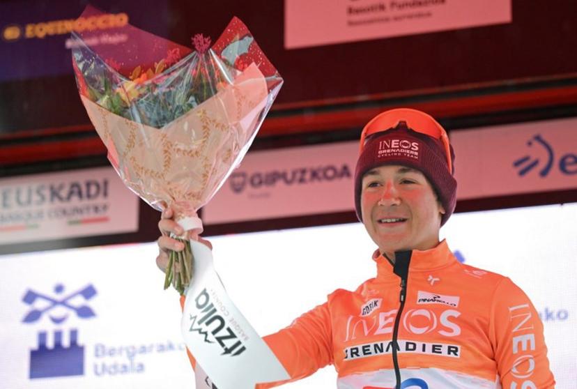 Stage winner team Ineos' US rider AJ August celebrates on the podium after the sixth and last stage of the Basque Country's Itzulia cycling tour, a 135.4 km race between Goizper-Antzuola and Bergara, on April 11, 2026. ANDER GILLENEA / AFP