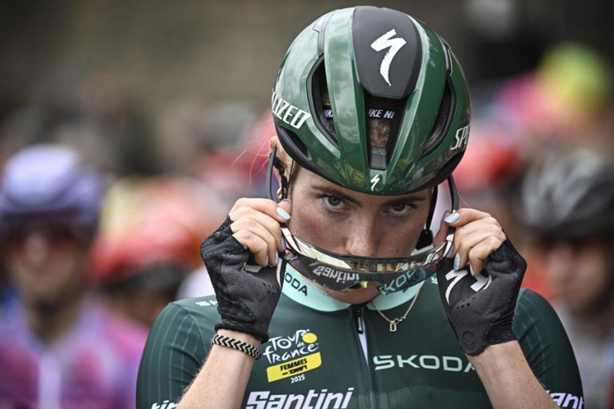 FDJ-SUEZ team's Dutch rider Demi Vollering adjusts her cycling glasses during the 2nd stage (out of 9) of the fourth edition of the Women's Tour de France cycling race, 110,4 km from Brest to Quimper, in France, on July 27, 2025. JULIEN DE ROSA / AFP