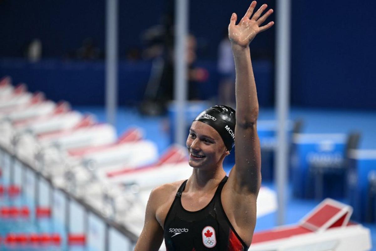 Canada's Summer Mcintosh celebrates after winning the final of the women's 200m individual medley swimming event during the Paris 2024 Olympic Games at the Paris La Defense Arena in Nanterre, west of Paris, on August 3, 2024. Jonathan NACKSTRAND / AFP