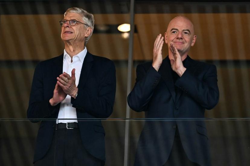 Former Arsenal's French manager Arsene Wenger (L) and FIFA President Gianni Infantino applaud ahead of the UEFA Women's Euro 2025 quarter-final football match between Sweden and England at Letzigrund Stadium in Zurich, on July 17, 2025. Fabrice COFFRINI / AFP