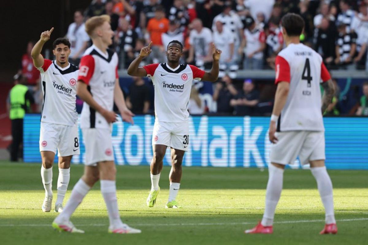 Frankfurt's Belgian forward #30 Michy Batshuayi (2nd R) celebrates scoring the 2-2 goal with his teammates during the German first division Bundesliga football match between Eintracht Frankfurt and FC St. Pauli in Frankfurt, western Germany, on May 11, 2025. Daniel ROLAND / AFP