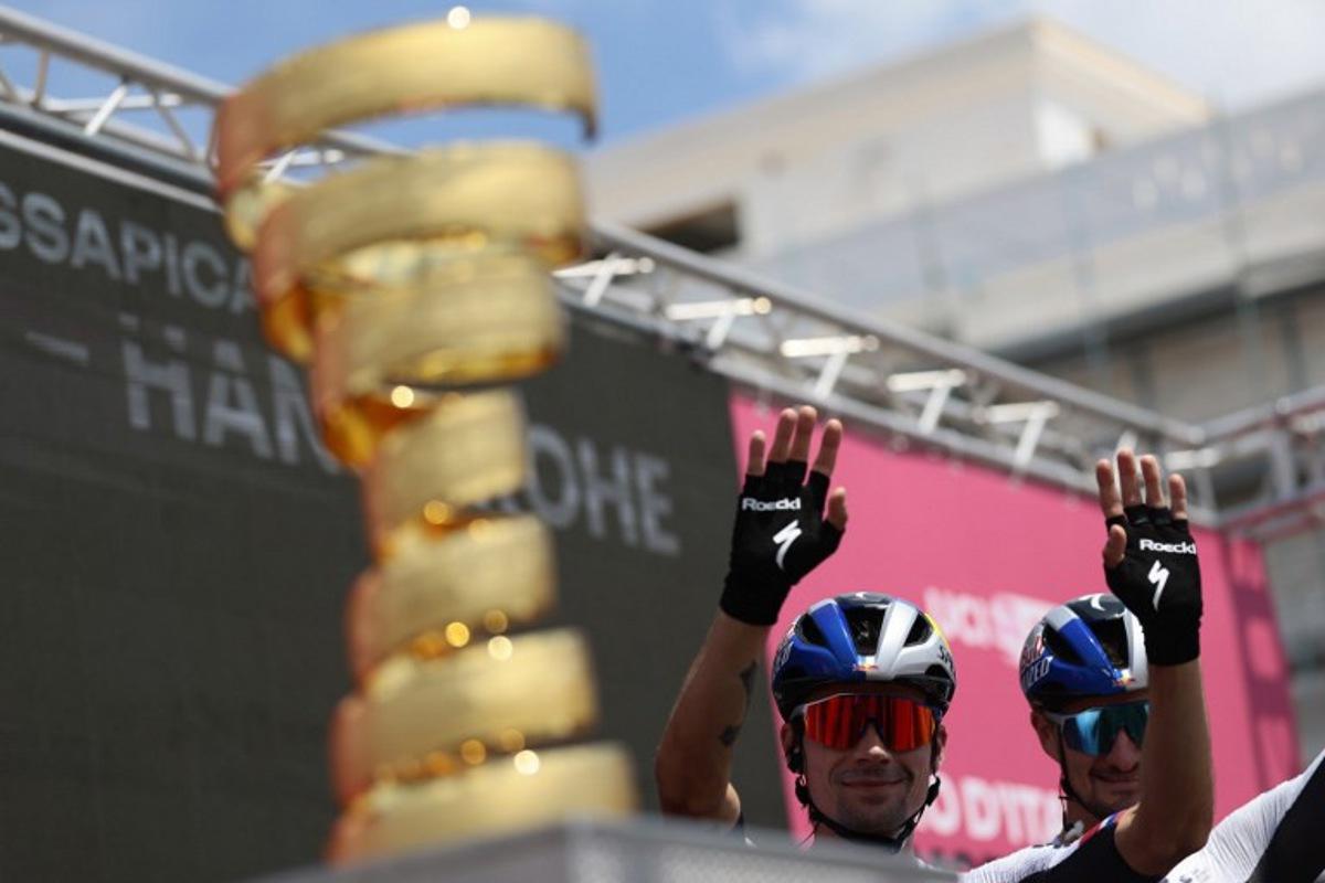 Red Bull-Bora-Hansgrohe's Slovenian rider Primoz Roglic waves at the crowd during the ceremony ahead of the start of the 5th stage of the 108th Giro d'Italia cycling race 151kms from Ceglie Messapica to Matera on May 14, 2025. Luca Bettini / AFP