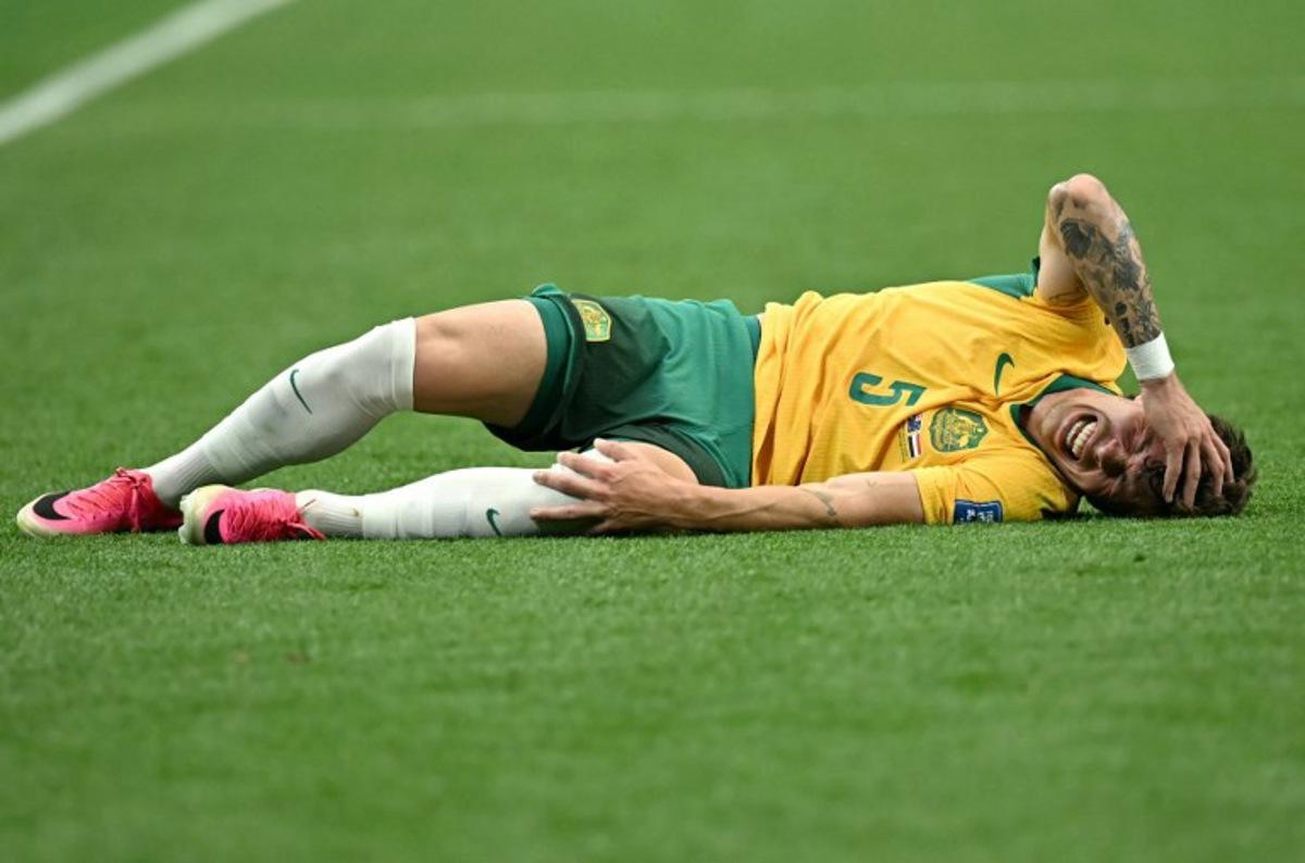 Australia's defender #05 Jordan Bos reacts on the ground during the 2026 World Cup round of 32 football match between Australia and Egypt at the Dallas Stadium in Arlington on July 3, 2026. Paul ELLIS / AFP