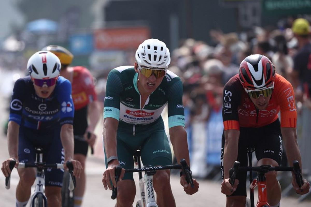 Alpecin-Deceuninck's Dutch rider Mathieu van der Poel (C) wearing the sprinter's green jersey reacts as he crosses the finish line of the 3rd stage of the 77th edition of the Criterium du Dauphine cycling race, 207,2 km between Brioude and Charantonnay, on June 10, 2025. Anne-Christine POUJOULAT / AFP